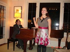 Charlotte Khuner (accompanied by Jonathan Khuner) performing at the Children Holiday Musicale at the Arts House of Becky and Mike O'Malley, organized by Eliza O'Malley, Dec. 2011